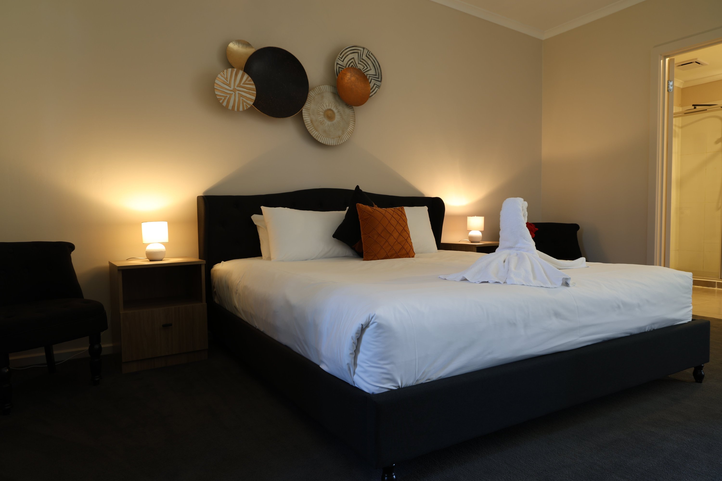 King Spa Room with king bed and bedside lamps