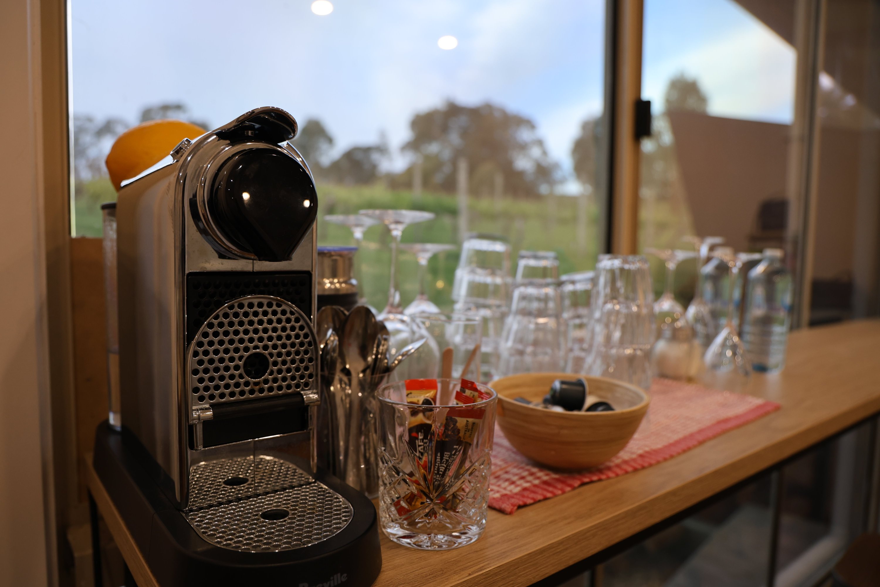 Coffee machine and glassware in the shared kitchen